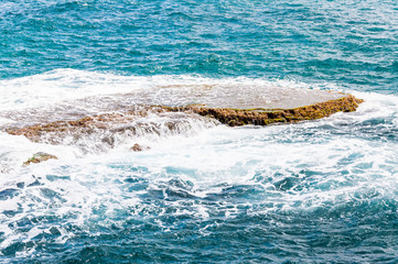 Fototapeta premium Rocks washed by water on Northern Mediterranean Sea Coast in Rosh Hanikra, Israel