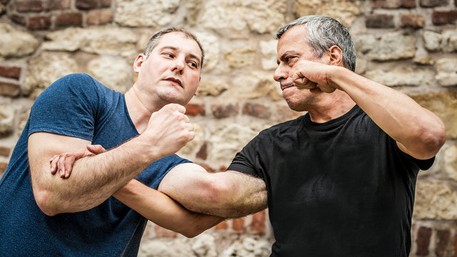 Kapap instructor demonstrates street fighting self defense techniques. Martial arts