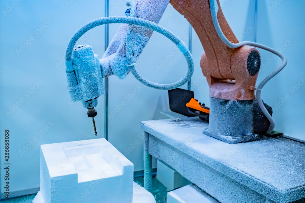 Poster robotic arm. automation of production. the machine is controlled through a computer. the robot perfo