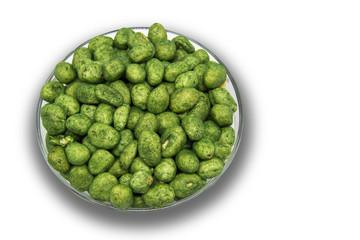 Wasabi coated snack peanuts isolated.