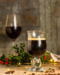 coffee in a transparent mug (with milk and spices). Top view. copy space
