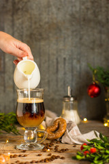 coffee in a transparent mug (with milk and spices). Top view. copy space