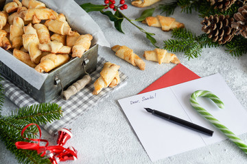 Just Baked Croissant Cookies with Filling in an iron box. Christmas pastries, a wreath, sweets and...