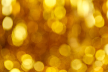 Defocused abstract golden christmas background with blinking lights