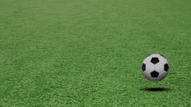 Bouncing and rotating soccer ball on football field.