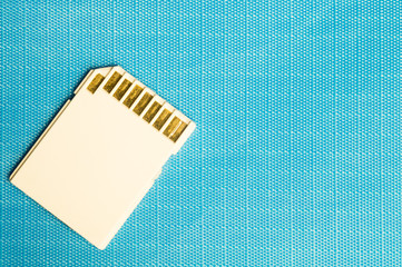 Memory card isolated on blue background. Sd card and copy space
