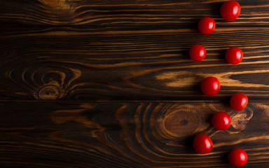 Top view of Cherry tomatoes on wooden table