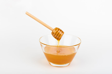 honey in jars on white table