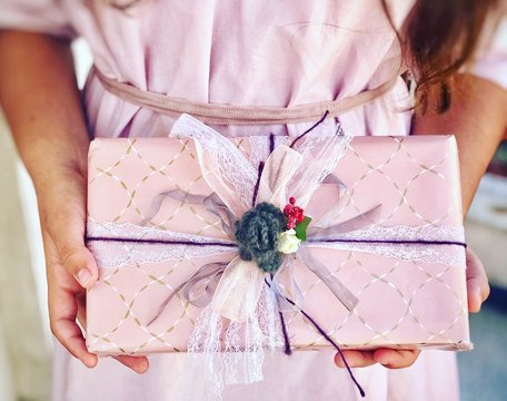 Girl holding a wrapped gift