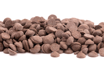 Pile of Unsweetened Carob Chips on a White Background