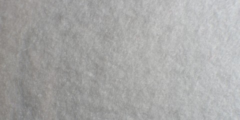 White artificial foam, foam texture on a light background.