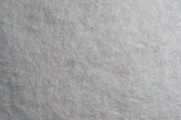 White artificial foam, foam texture on a light background.