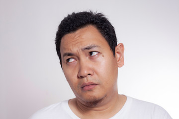 Obraz premium Funny Asian Man Thinking