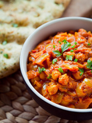 Chickpea Tomato Vegetarian, Vegan, Plant Based Curry  -  Chana Masala with Naan Bread. Chana masala, also known as channay, chole masala, chole or chholay, is a dish originating from the India.