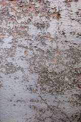 Wand mir alter, gebrauchter, gerissener Malerei, Farbe grau monochrom abgeblättert. Grunge Farbe ergibt ein freies abstraktes Muster Hintergrund Textur. 