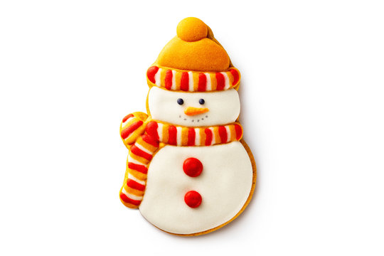 Closeup gingerbread christmas snowman wearing yellow scarf and hat cookie isolated at white background.