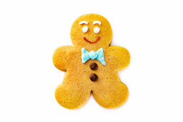 Smiling single gingerbread man christmas cookie isolated at white background.