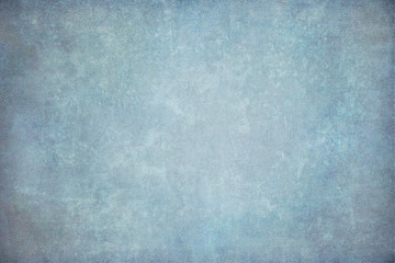 Fototapeta na wymiar Blue painted canvas or muslin fabric cloth studio backdrop
