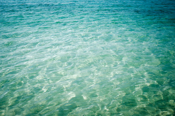 Fototapeta na wymiar light blue green water background, dream of tropical beach