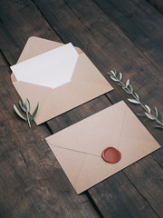 Envelope with an elegant wedding invitation. Place card mockup.
