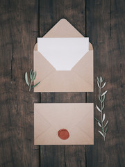Envelope with an elegant wedding invitation. Place card mockup.