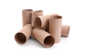 Empty paper toilet rolls on white background