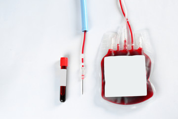 Blood pack for transfusion and test tube on white background, top view. Donation day