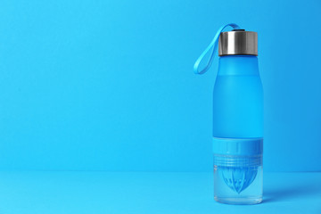 Sport bottle with space for text on color background