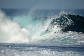 Fototapeta na wymiar surfer in action on a big wave