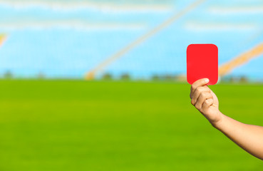 Naklejka premium Football referee showing red card at stadium, closeup with space for text