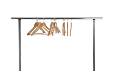 Wardrobe rack with wooden hangers isolated on white