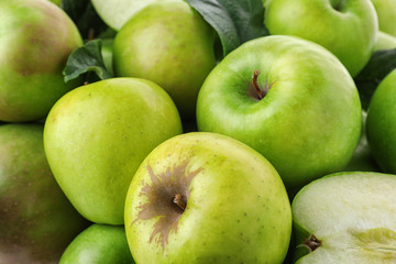Many ripe juicy green apples as background