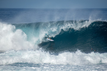 surfer in action on a big wave