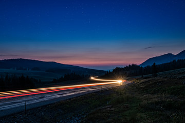 Highway light trails sunset