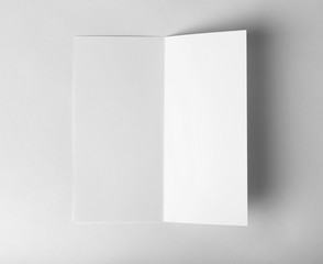 Blank brochure mock up on white background, top view