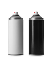 Cans of different spray paints on white background
