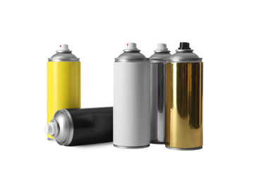 Cans of different spray paints on white background