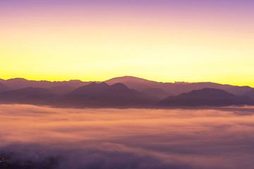                      Landscape view of sunrise with white fog  in early morning covered on the top of the hill at yun lai viewpoint, pai, Mae Hong Son, thailand