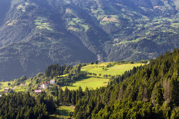 View of high plateau village, mountains, valleys and forest creating beautiful nature scene. The image is captured in Trabzon/Rize area of Black Sea region located at northeast of Turkey.