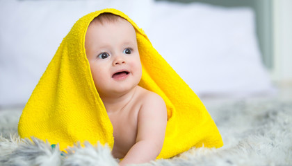 infant baby boy crawl with towel