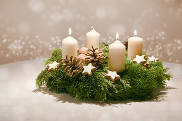 Third Advent - decorated Advent wreath from fir and evergreen branches with white burning candles, tradition in the time before Christmas, warm background with festive bokeh and copy space - obrazy, fototapety, plakaty
