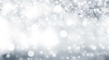 Fototapeta premium white snow blur abstract background. Bokeh Christmas blurred beautiful shiny Christmas lights. white and gray winter backdrop.