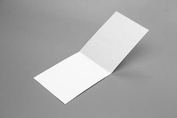 Blank portrait mock-up paper. brochure magazine isolated on gray, changeable background / white paper isolated on gray