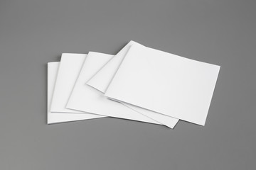 Blank portrait mock-up paper. brochure magazine isolated on gray, changeable background / white paper isolated on gray