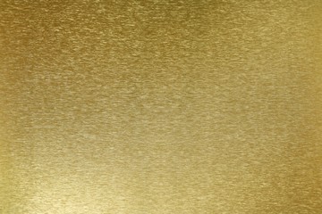 Texture of shiny old golden plate, abstract background, selective focus