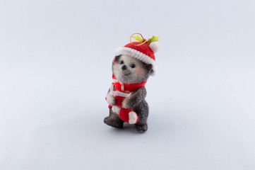 Toy bear wearing santa cloths christmas tree ornament