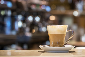 Coffee  - latte on a transparent glass indoors.