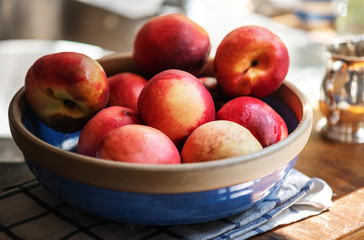 Fresh organic nectarines in a bowl