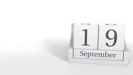 Wood cube calendar shows September 19 date, 3D animation