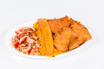 Ecuadorian national dish with rice, deep-fried fish, fried banana and vegetable salad 
